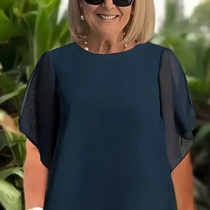 Charmigt set med oregelbunden topp Elegant set med vida byxor – Bekväma och perfekta för våren