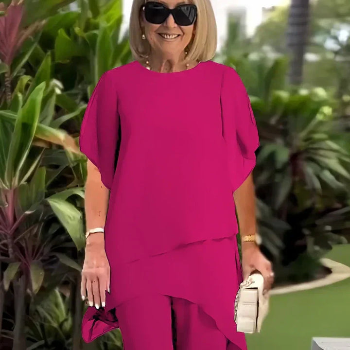 Charmigt set med oregelbunden topp Elegant set med vida byxor – Bekväma och perfekta för våren